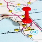Close up image of Florida on a map with a pin over Tampa.