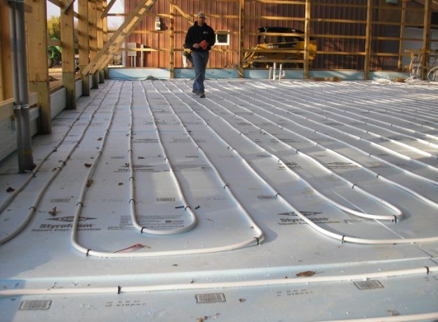 Running in Concrete Slab PEX Inside Large Tubing - Hansen Buildings